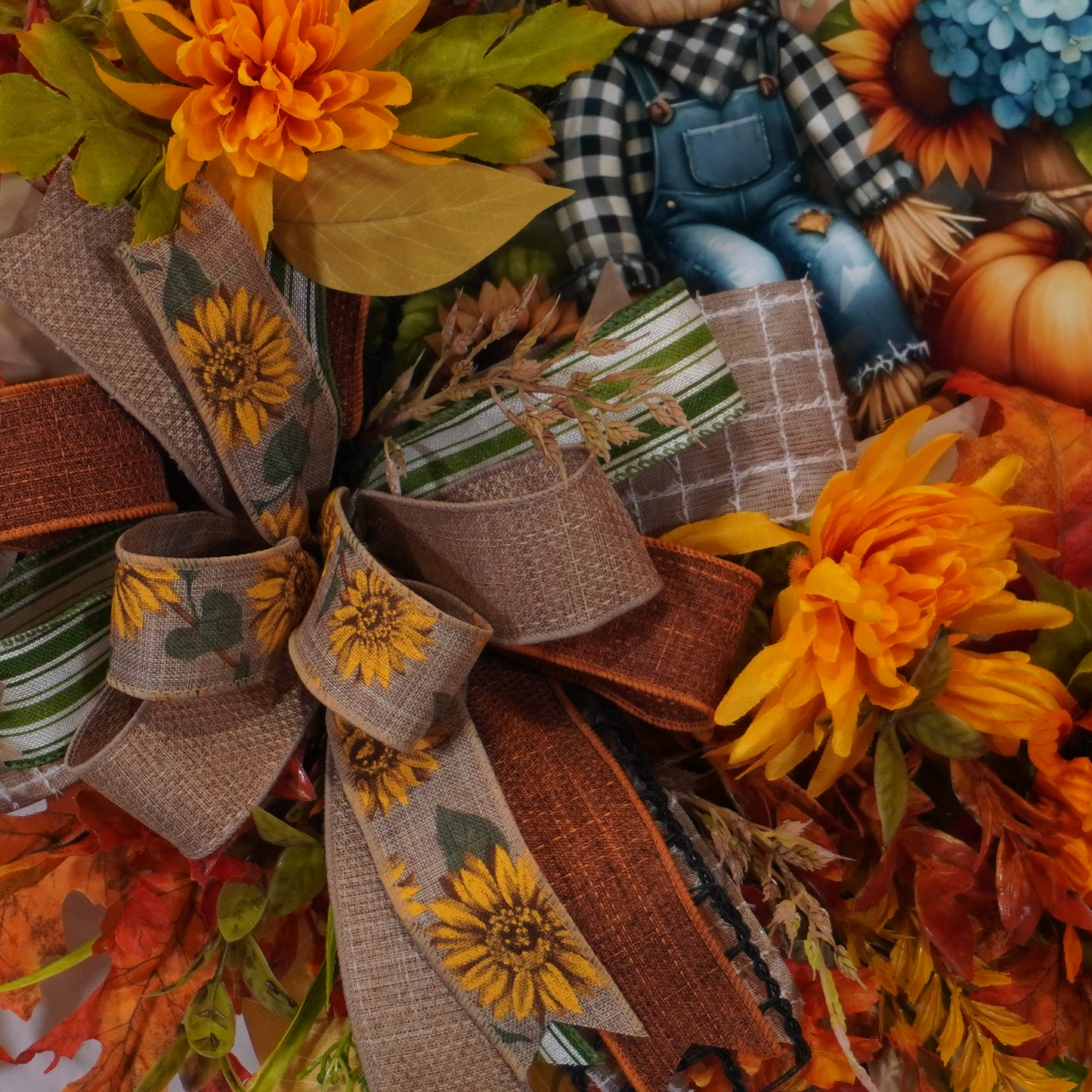 Fall Grapevine wreath with Sunflowers, and a metal sign with a Scarecrow, Blue Hydrangeas, and pumpkins