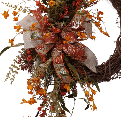 Fall grapevine wreath with Orange filler flowers and a large bow with Orange and Sage pumpkins