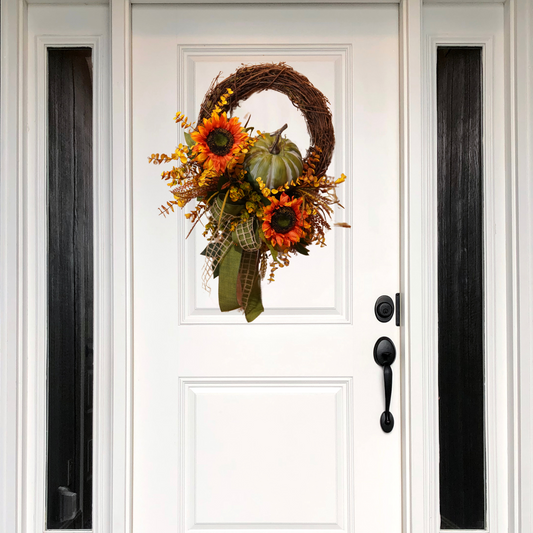 Fall Grapevine wreath with large Moss colored pumpkin attachment and two large sunflowers