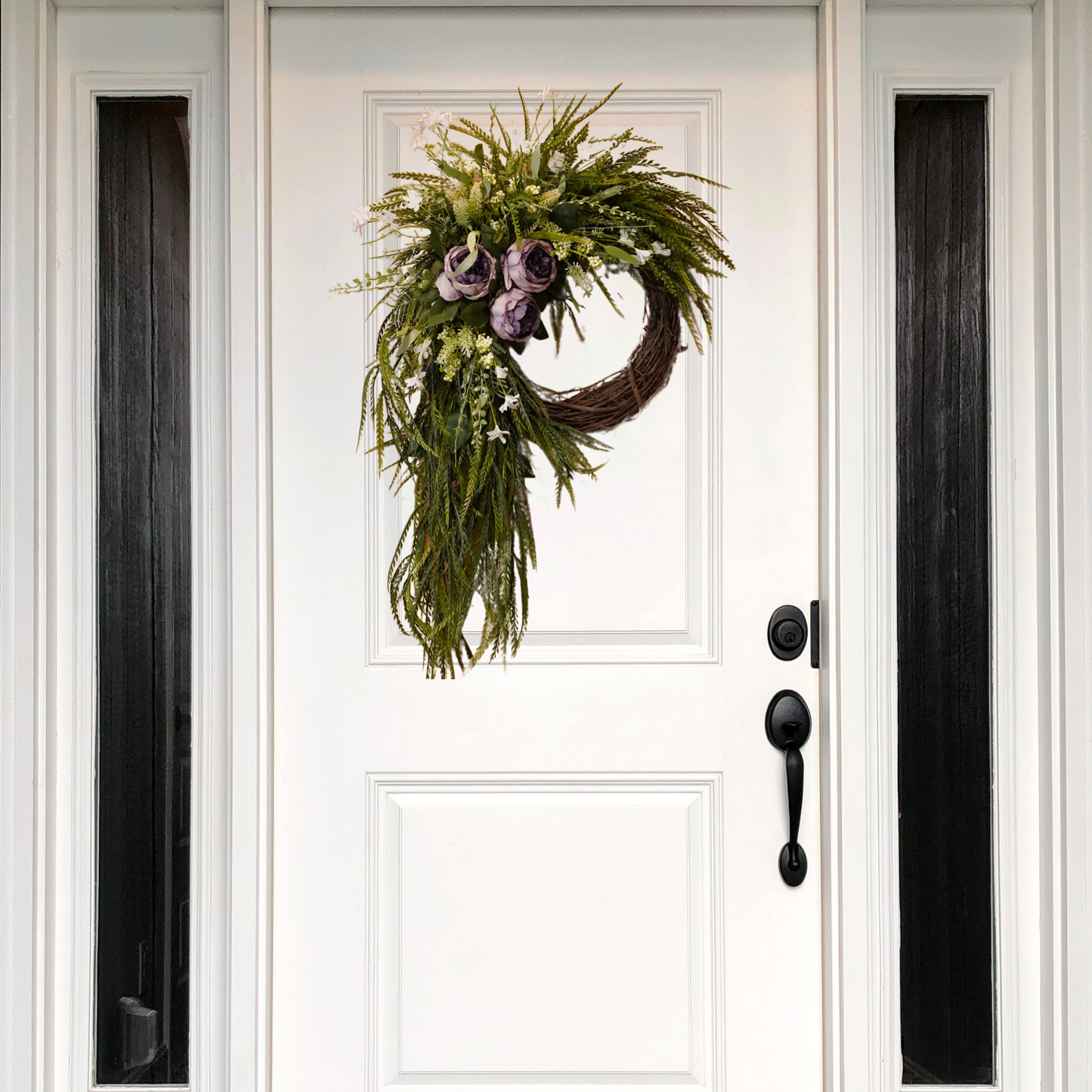 Trendy Sawgrass Grapevine wreath with Purple Peonies and White floral filler bush