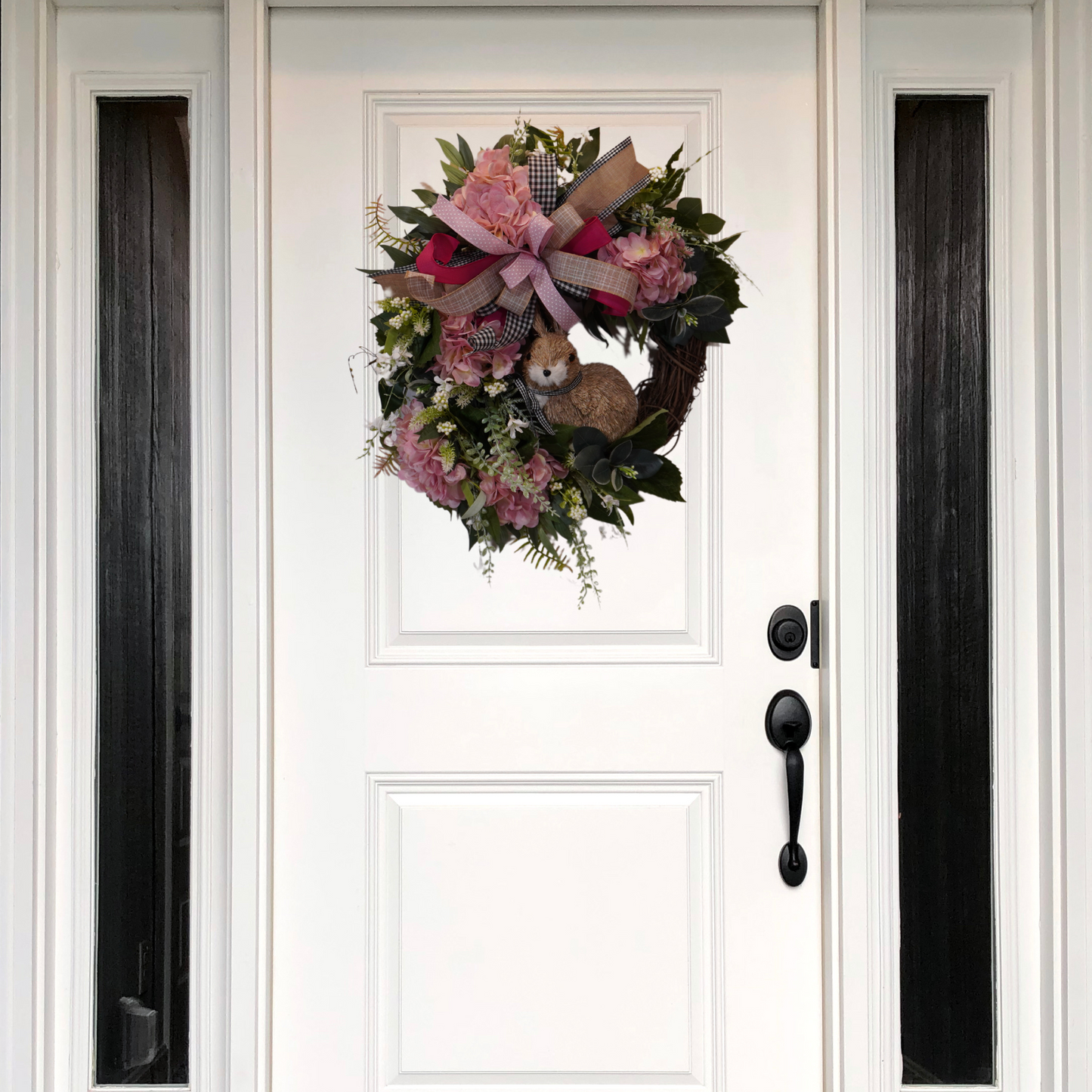 Spring Easter Bunny wreath with Pink Hydrangeas, Greenery, and a bow on a grapevine base