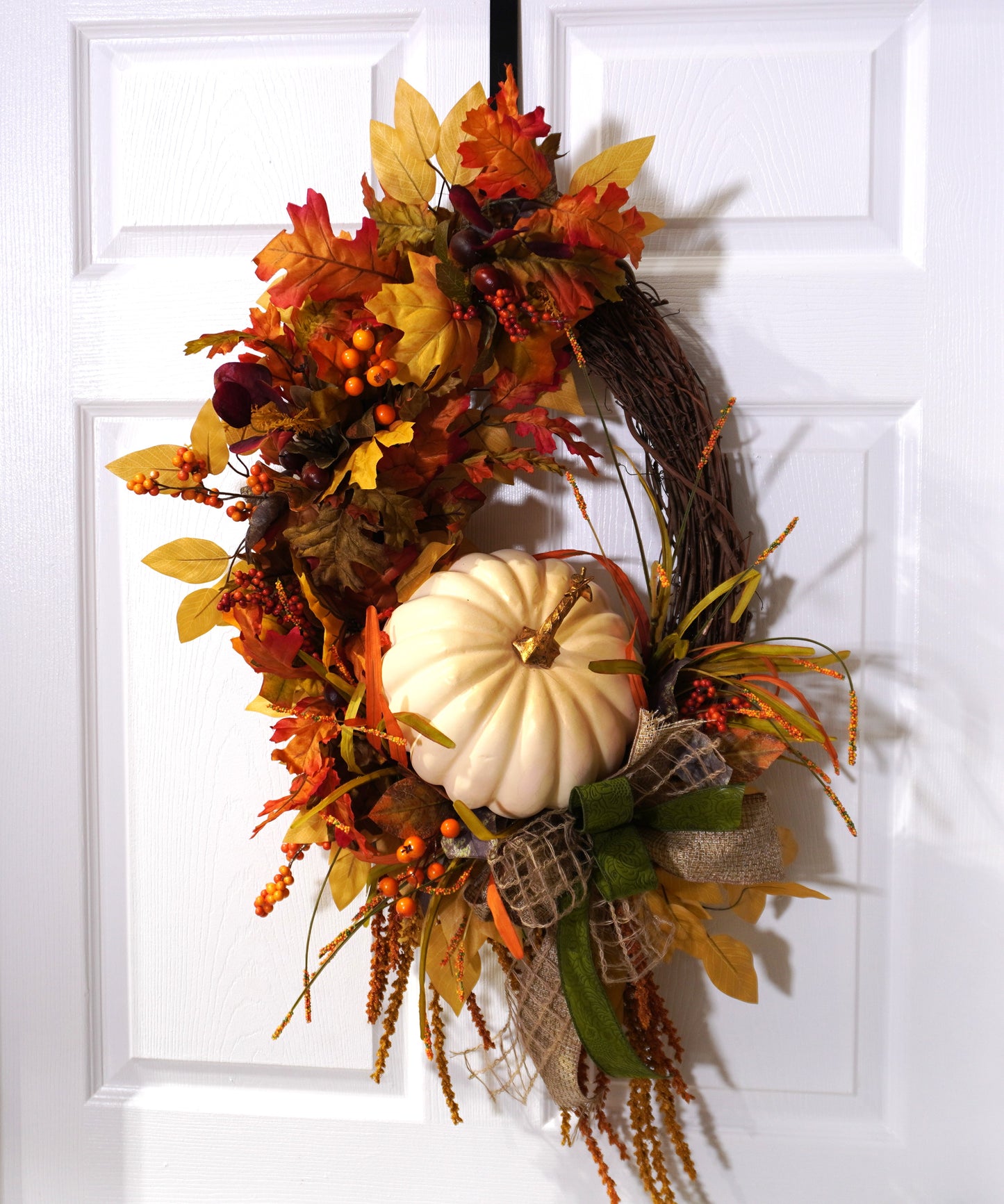 Fall Grapevine Wreath with a Cream colored pumpkin, Fall colored leaves and Berries